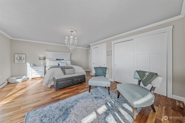 bedroom featuring crown molding, a notable chandelier, and wood-type flooring