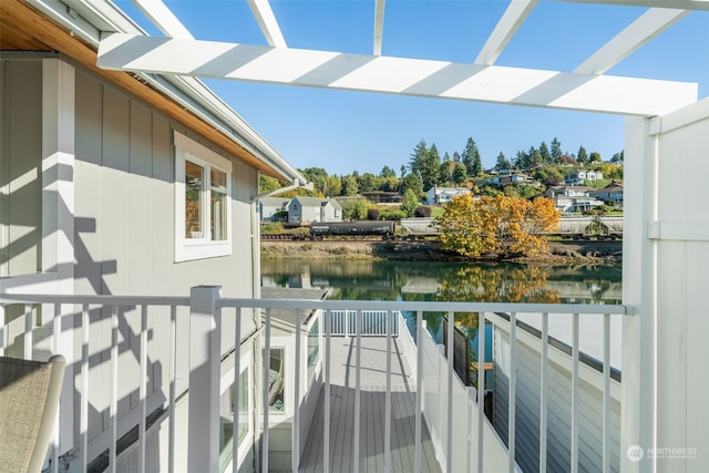 balcony featuring a water view