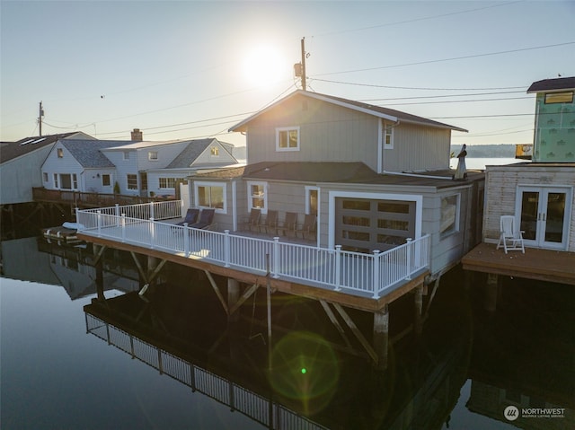 back of house with a deck and french doors