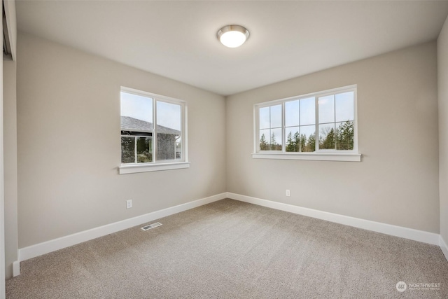 view of carpeted spare room