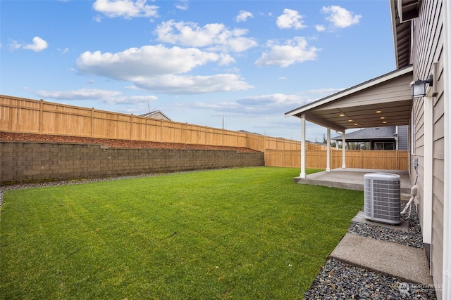 view of yard featuring a patio and central AC unit