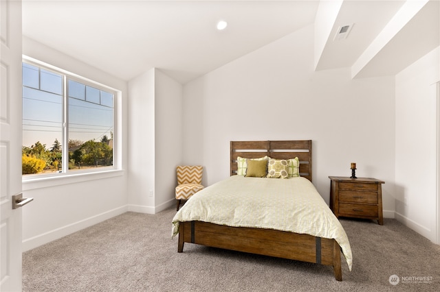 bedroom featuring carpet flooring and vaulted ceiling