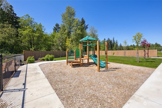 view of playground featuring a lawn