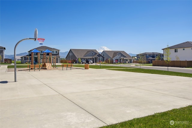 view of sport court with a playground