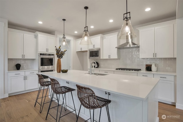 kitchen with light countertops, appliances with stainless steel finishes, and white cabinets