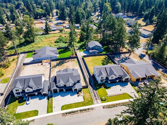 birds eye view of property with a residential view