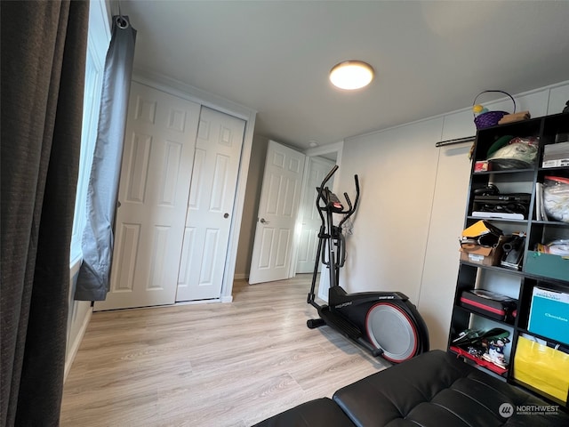 workout area featuring wood finished floors