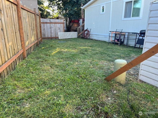 view of yard featuring a fenced backyard