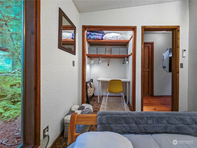 bedroom with lofted ceiling