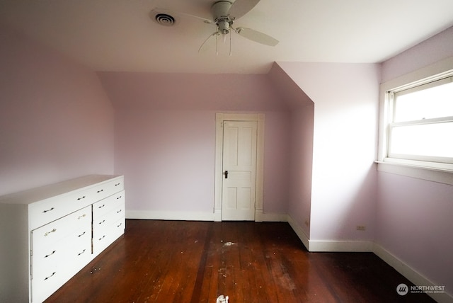 bonus room with ceiling fan and dark hardwood / wood-style floors