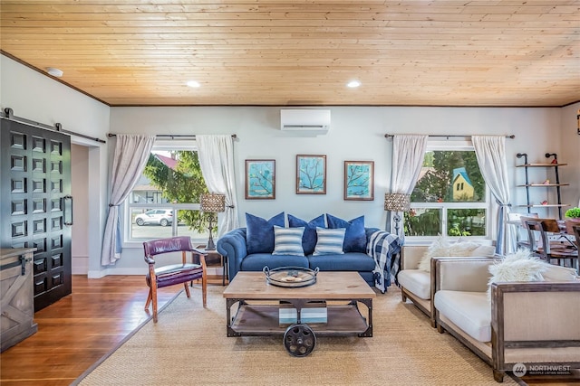 living room featuring a wall unit AC, wood-type flooring, a wealth of natural light, and wooden ceiling