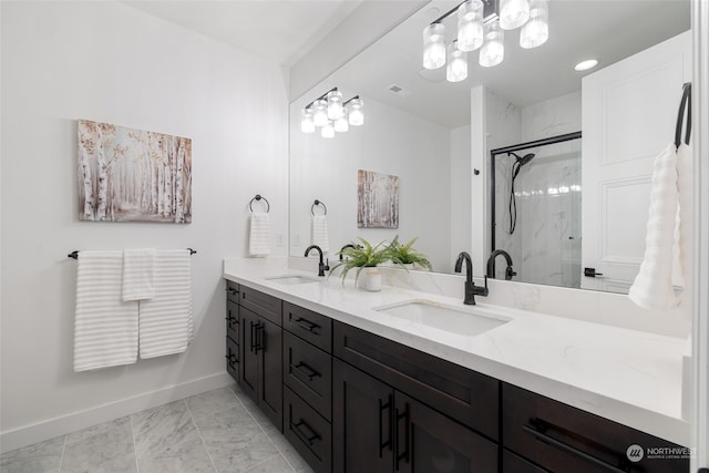 bathroom featuring an enclosed shower and vanity