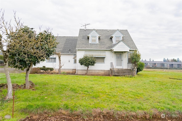 cape cod house featuring a front lawn