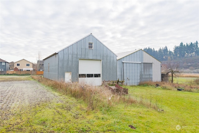 view of outbuilding featuring a yard