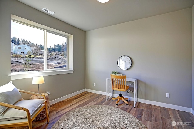 office with hardwood / wood-style flooring