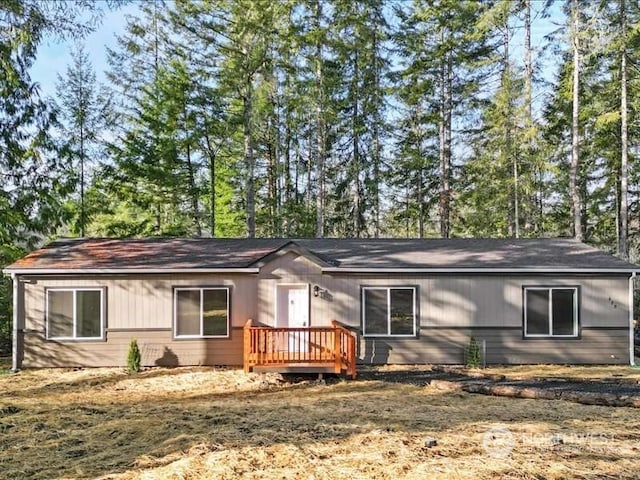 view of front of house featuring a wooden deck