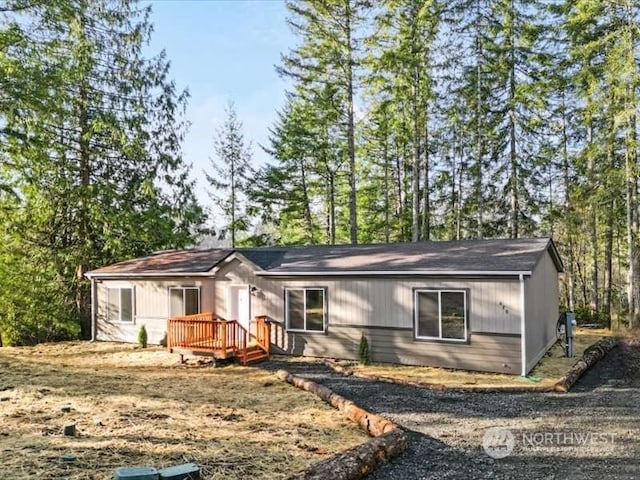 ranch-style home with a deck