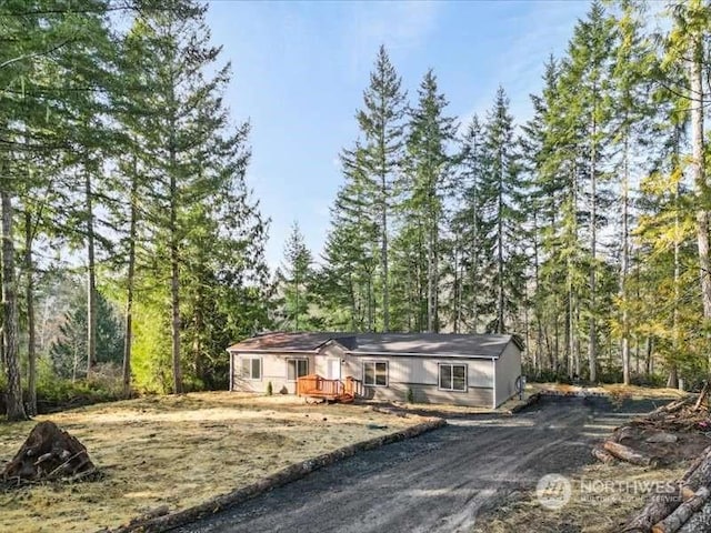 670 E Wilson Way, Grapeview, WA 98546 - single story home with a forest view
