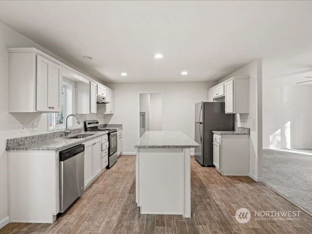 kitchen featuring white cabinetry, light hardwood / wood-style floors, sink, and stainless steel appliances