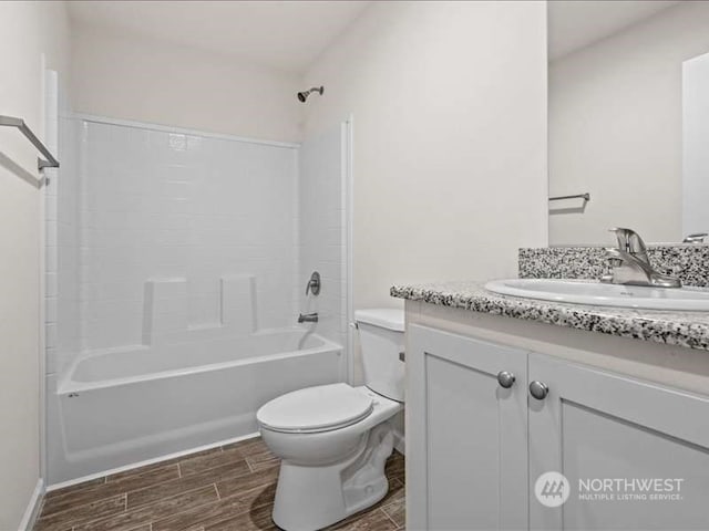 full bathroom with shower / bathtub combination, toilet, and vanity