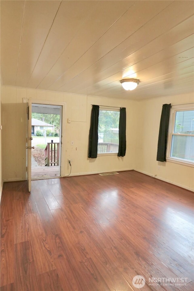 14040 Ashworth Ave N, Seattle, WA 98133 - spare room featuring healthy amount of natural light and wood finished floors