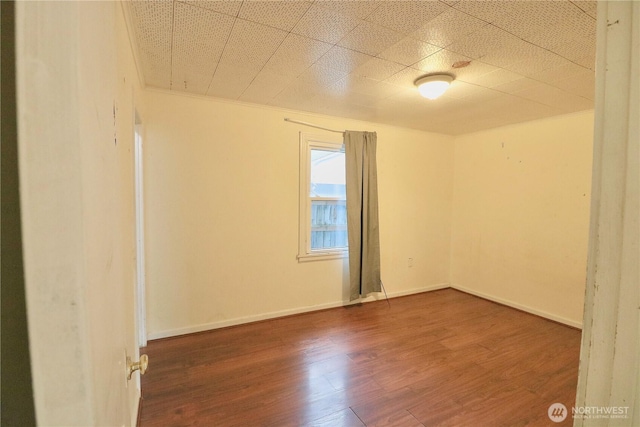 14040 Ashworth Ave N, Seattle, WA 98133 - unfurnished room with wood finished floors and baseboards