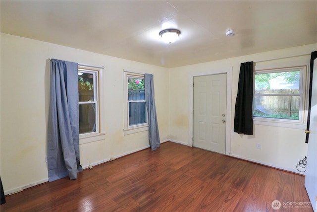 14040 Ashworth Ave N, Seattle, WA 98133 - empty room featuring wood finished floors, baseboards, and a smoke detector