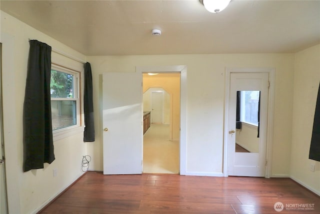 14040 Ashworth Ave N, Seattle, WA 98133 - empty room with wood finished floors, a smoke detector, and baseboards