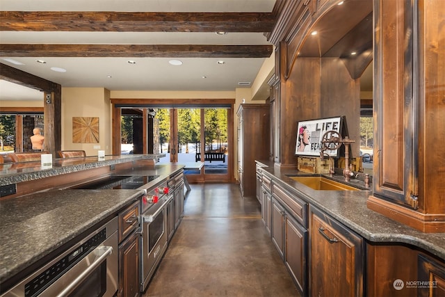 kitchen with recessed lighting, concrete flooring, a sink, and beam ceiling