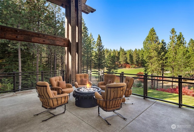 view of patio / terrace featuring a fire pit