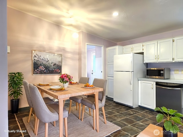 kitchen featuring white cabinets, black dishwasher, crown molding, and white refrigerator