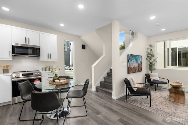 dining space with hardwood / wood-style flooring and a wealth of natural light