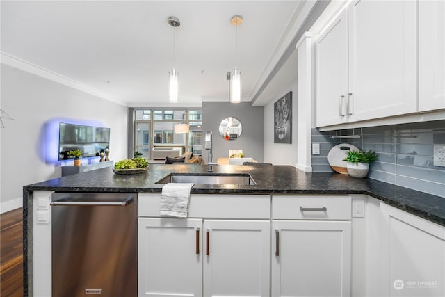 kitchen with sink, white cabinets, dishwasher, tasteful backsplash, and ornamental molding