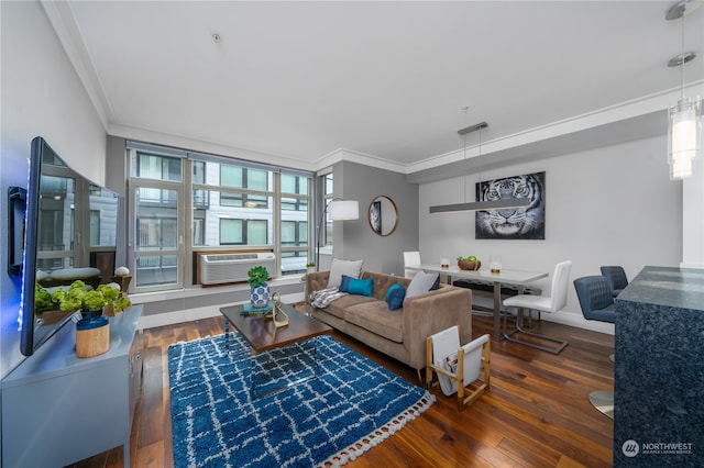 living room with crown molding, dark wood-type flooring, and an AC wall unit