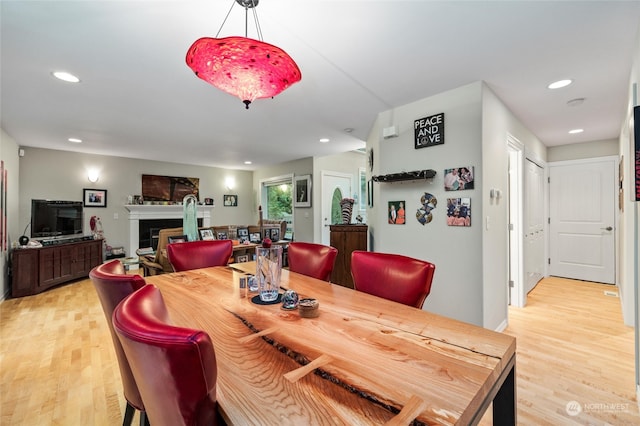 dining space with light hardwood / wood-style flooring