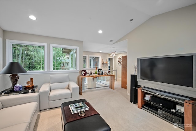 living room with vaulted ceiling and light colored carpet