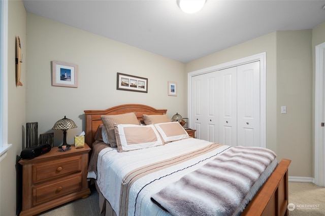 bedroom with carpet floors and a closet