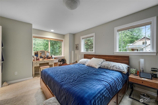 bedroom featuring light colored carpet