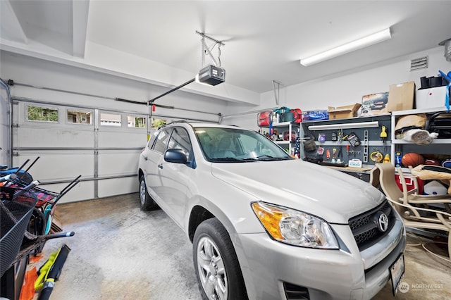 garage featuring a garage door opener