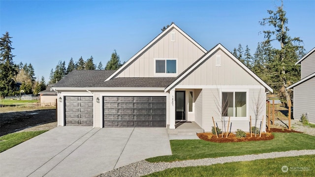 view of front of home with an attached garage, concrete driveway, roof with shingles, board and batten siding, and a front yard