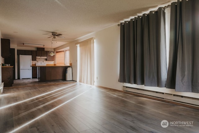 unfurnished living room featuring ceiling fan, a baseboard radiator, and dark wood-type flooring