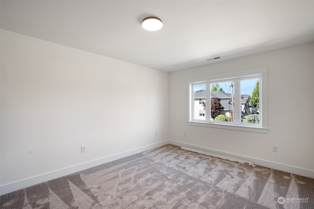 empty room featuring light colored carpet