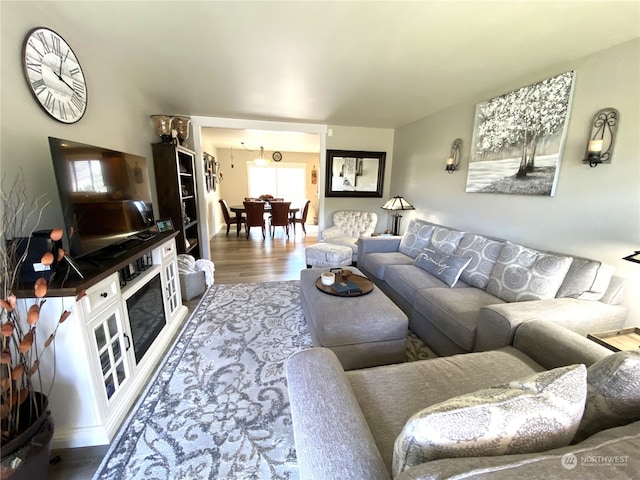 living room with hardwood / wood-style flooring and a fireplace