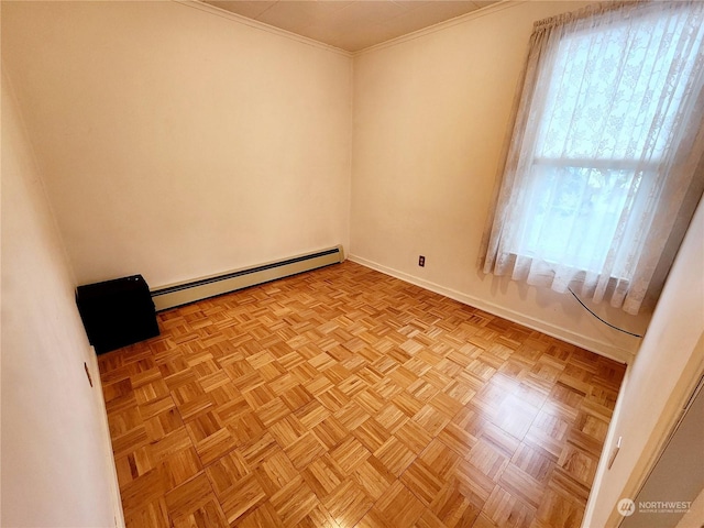 unfurnished room featuring baseboard heating, light parquet flooring, and a wealth of natural light