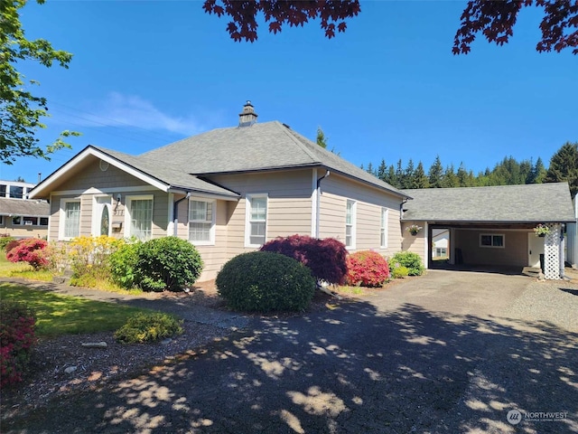 view of front of property with a carport