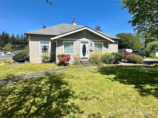 bungalow-style house featuring a front yard