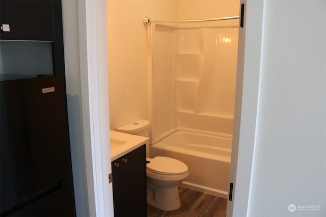 full bathroom featuring vanity, toilet, shower / washtub combination, and hardwood / wood-style floors