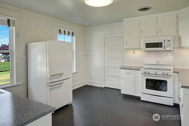 kitchen featuring decorative backsplash, white cabinetry, white appliances, and a wealth of natural light