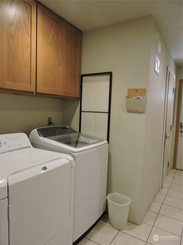 1402 Adams Rd N, Quincy, WA 98848 - laundry room with cabinet space, light tile patterned floors, and independent washer and dryer