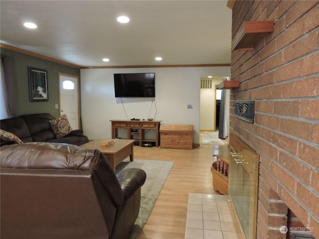 1402 Adams Rd N, Quincy, WA 98848 - living area with brick wall, light wood finished floors, ornamental molding, and recessed lighting